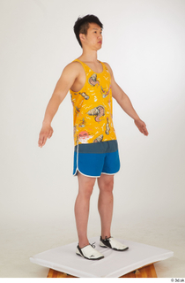  Lan a poses blue shorts dressed sports standing white sneakers whole body yellow printed tank top 0008.jpg